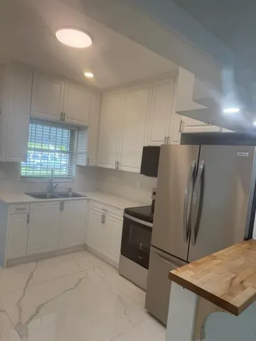 an empty room with a empty space and a window