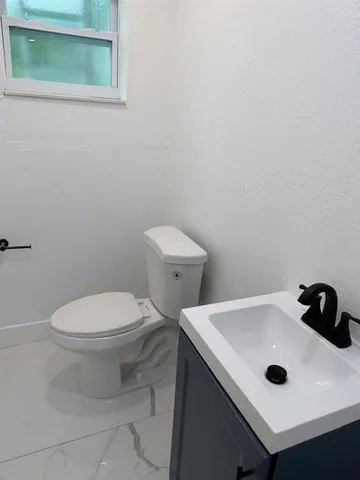 a bathroom with a sink and a toilet