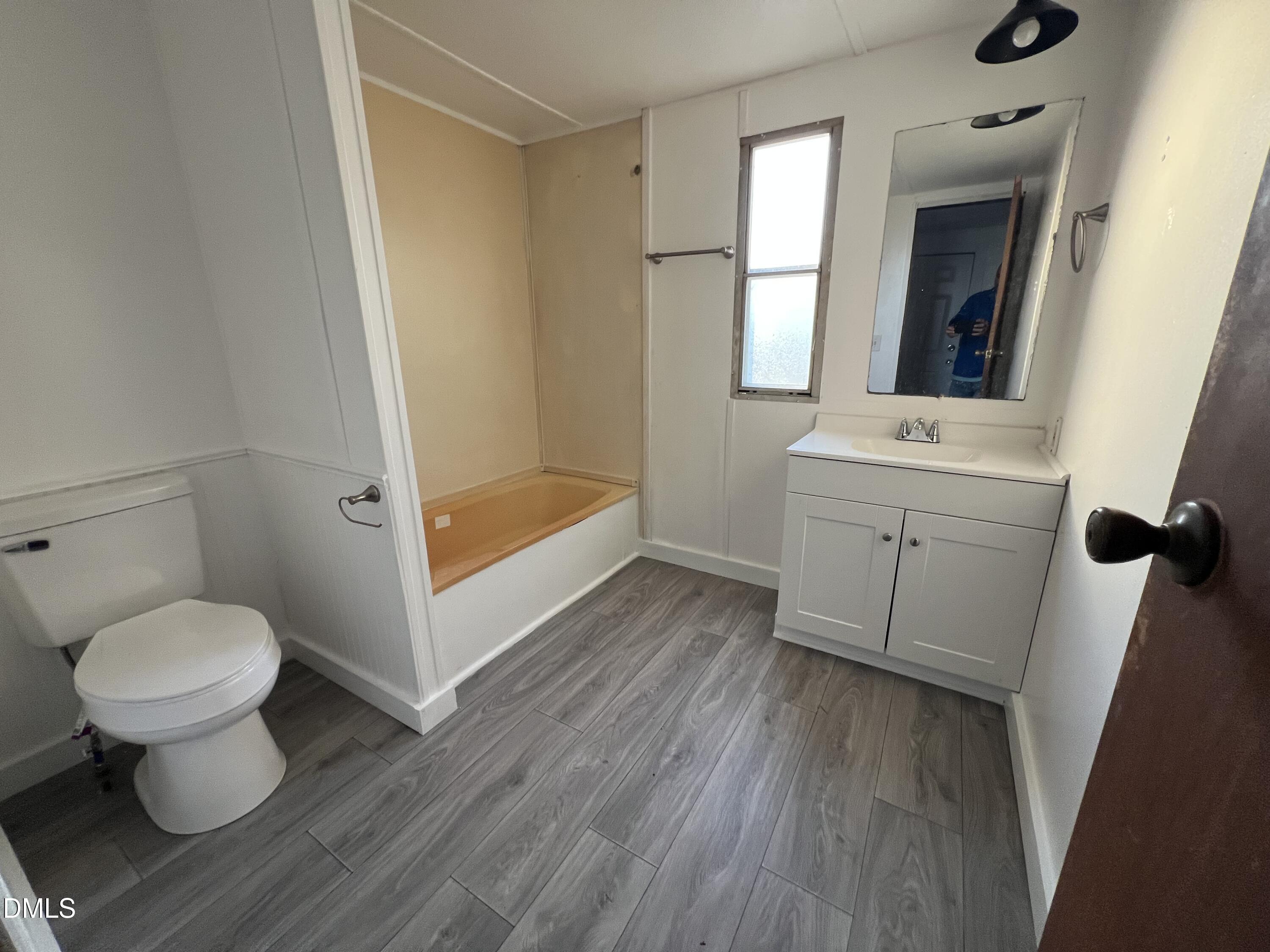 1071 Davis Bugg Road Warrenton, NC 27589 - Photo 12 of 13 a bathroom with a toilet sink and a bathtub
