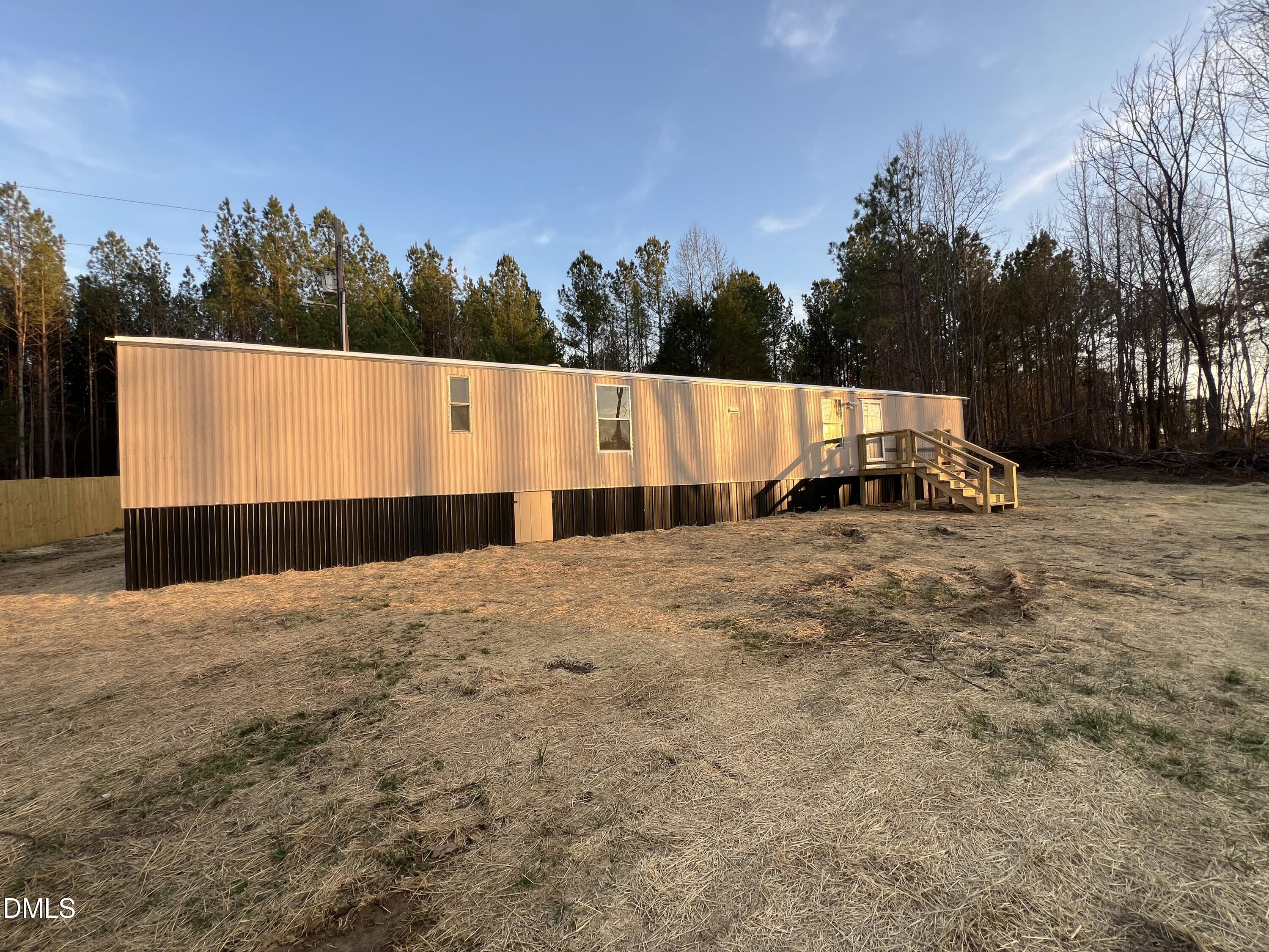1071 Davis Bugg Road Warrenton, NC 27589 - Photo 4 of 13 a view of tall trees with wooden fence
