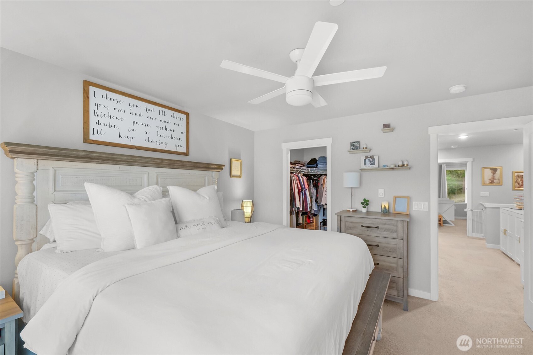 2012 101st Avenue Southeast, Unit 2 Lake Stevens, WA 98258 - Photo 20 of 33 a bedroom with a bed and a chandelier