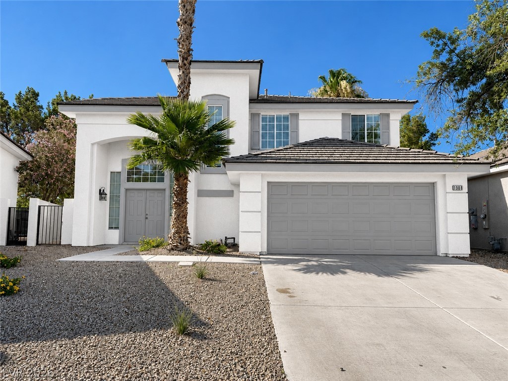 1908 Thunder Ridge Circle Henderson, NV 89012 - Photo 1 of 28 A striking modern facade with clean lines and mature palm trees welcomes you home.