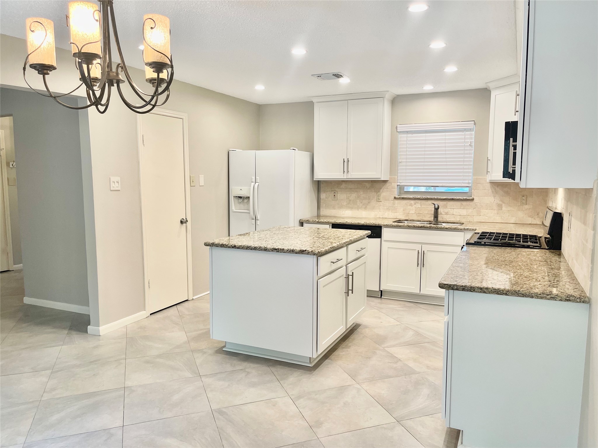 13 Maywind Court The Woodlands, TX 77381 - Photo 4 of 33 Furniture-grade cabinetry features abundant storage.