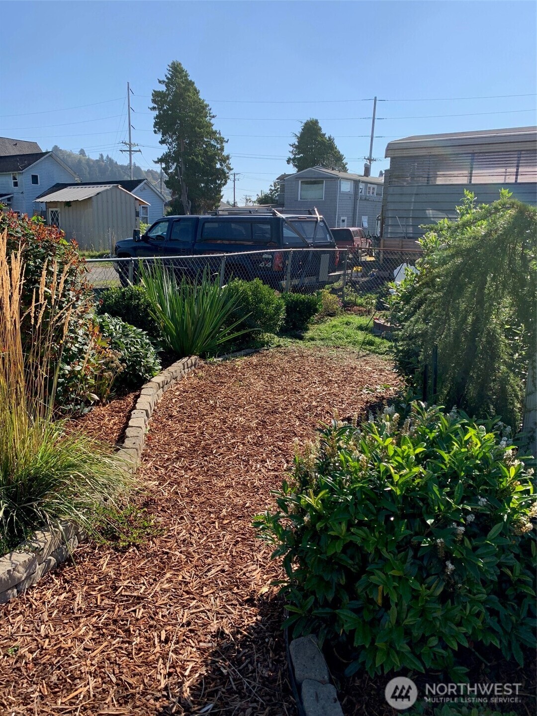 316 North F Street Aberdeen, WA 98520 - Photo 33 of 40 a view of a garden with a building in the background