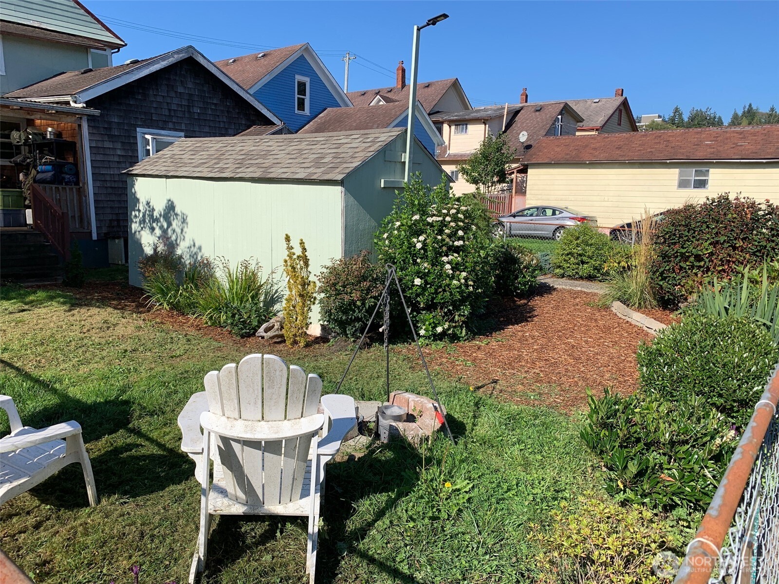 316 North F Street Aberdeen, WA 98520 - Photo 39 of 40 a view of a chair and table in backyard of the house