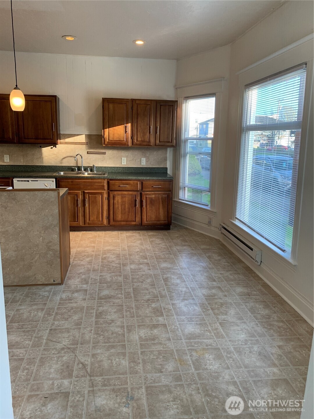 316 North F Street Aberdeen, WA 98520 - Photo 5 of 40 a large kitchen with stainless steel appliances and cabinets
