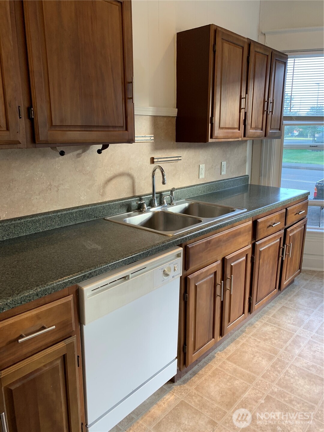 316 North F Street Aberdeen, WA 98520 - Photo 7 of 40 a kitchen with stainless steel appliances granite countertop a sink stove and cabinets