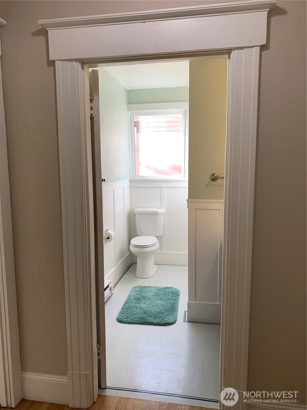 316 North F Street Aberdeen, WA 98520 - Photo 9 of 40 a bathroom with a toilet and a mirror