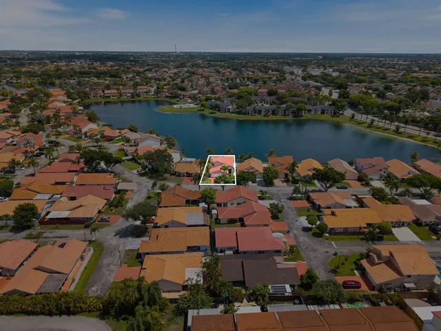 an aerial view of a houses with outdoor space