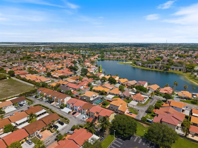 an aerial view of a city with ocean view