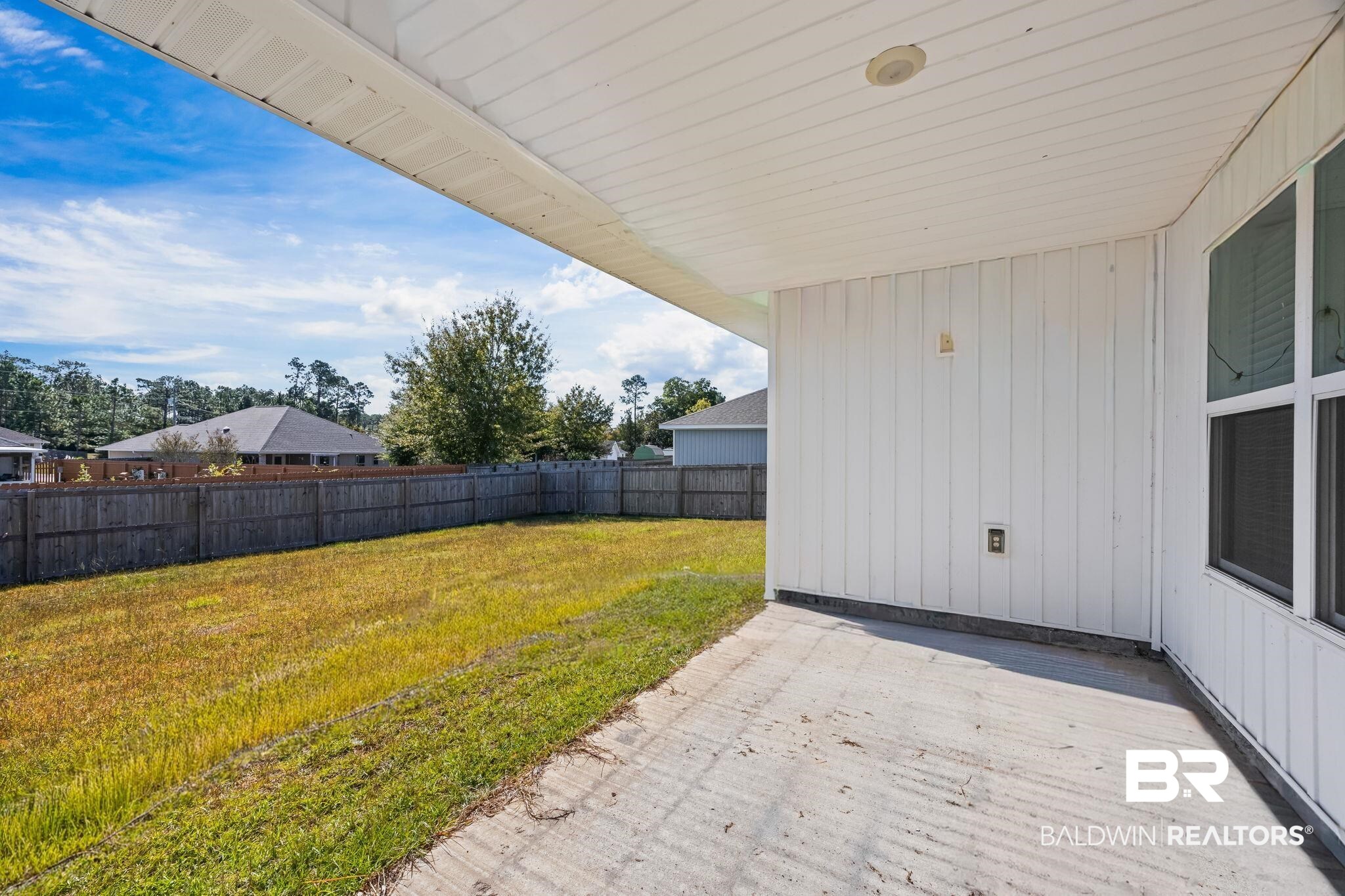 3090 Camino Real Loop Lillian, AL 36549 - Photo 8 of 29 Fenced backyard featuring a patio