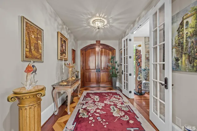 a large kitchen with kitchen island a large counter space a sink stainless steel appliances and cabinets