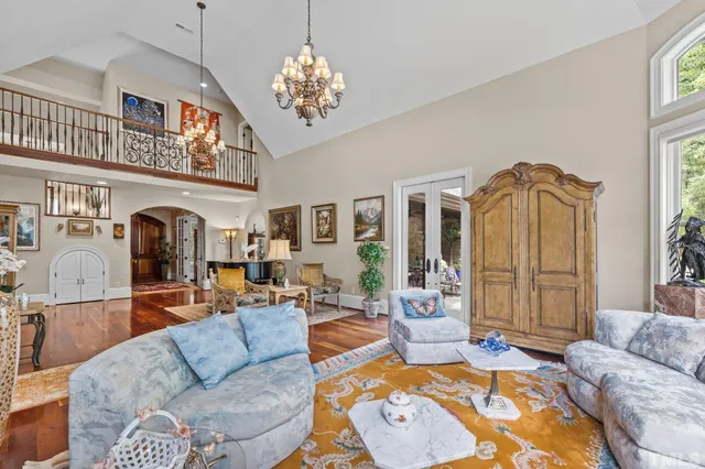 a living room with furniture a rug and a fireplace