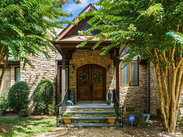 an aerial view of a house with a swimming pool