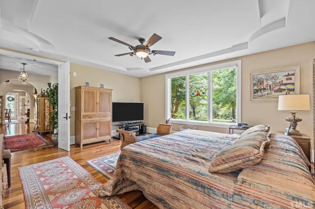 a living room with furniture or stairs and a wooden floor