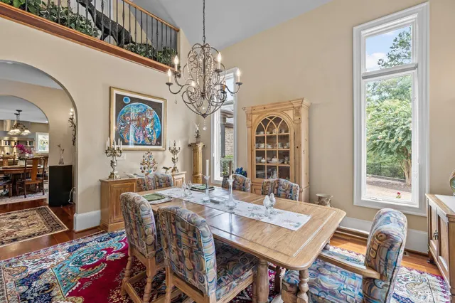 a view of a hallway with wooden floor and entryway