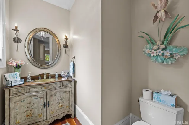 a view of a patio with chairs and a small yard