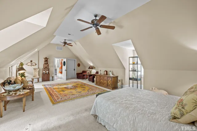 a view of road with yard and trees in the background