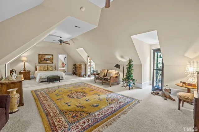 a view of a house with a yard and sitting area