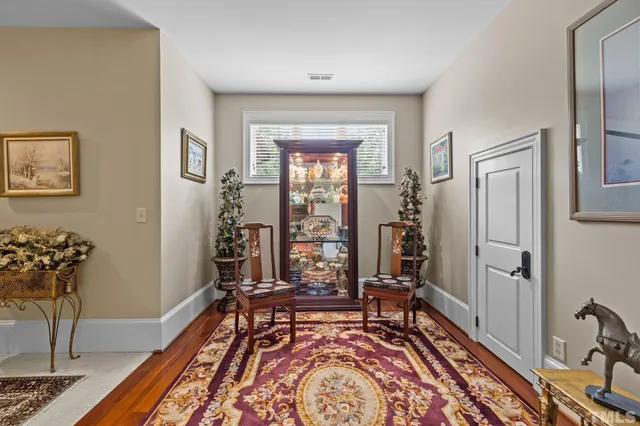 a view of house and garden with patio