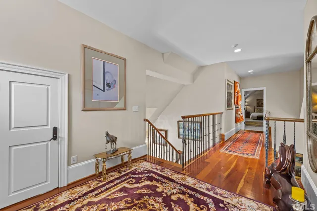 a patio with a table and chairs under an umbrella
