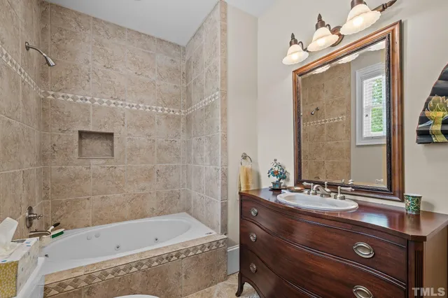 a view of a yard with plants and large trees