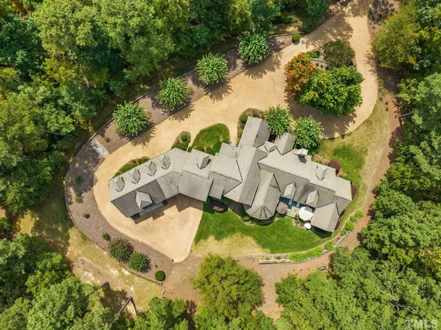 a front view of a house with a yard and a garage