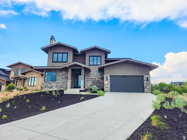 Contemporary exterior with stone and wood-look siding