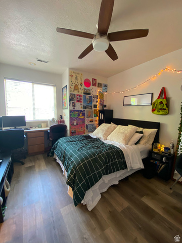 677 300 North, Unit 7 Provo, UT 84606 - Photo 12 of 16 Bedroom featuring wood-finish flooring, a ceiling fan with integrated lighting, and a double window with blinds