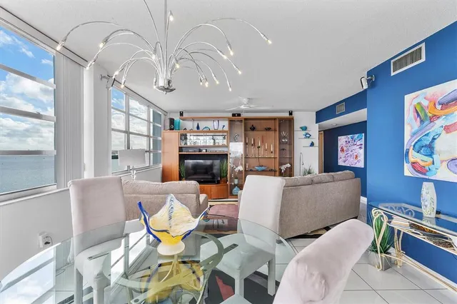 a bathroom with a granite countertop toilet sink and mirror