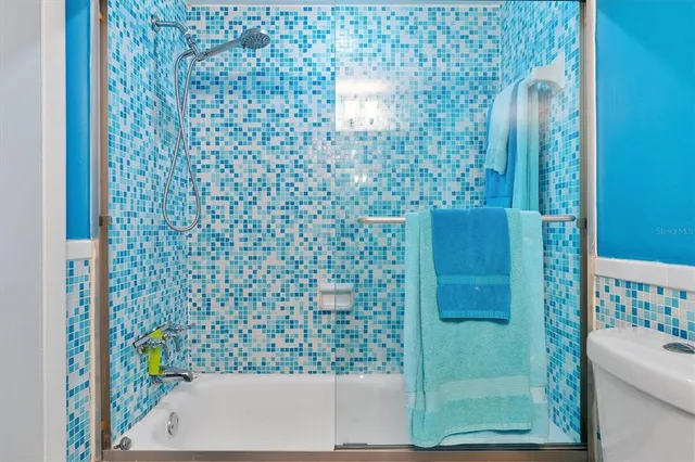 a living room with pool table furniture and a fireplace
