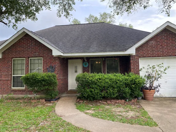 front view of house with potted plants