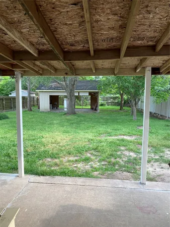 a view of a backyard of the house