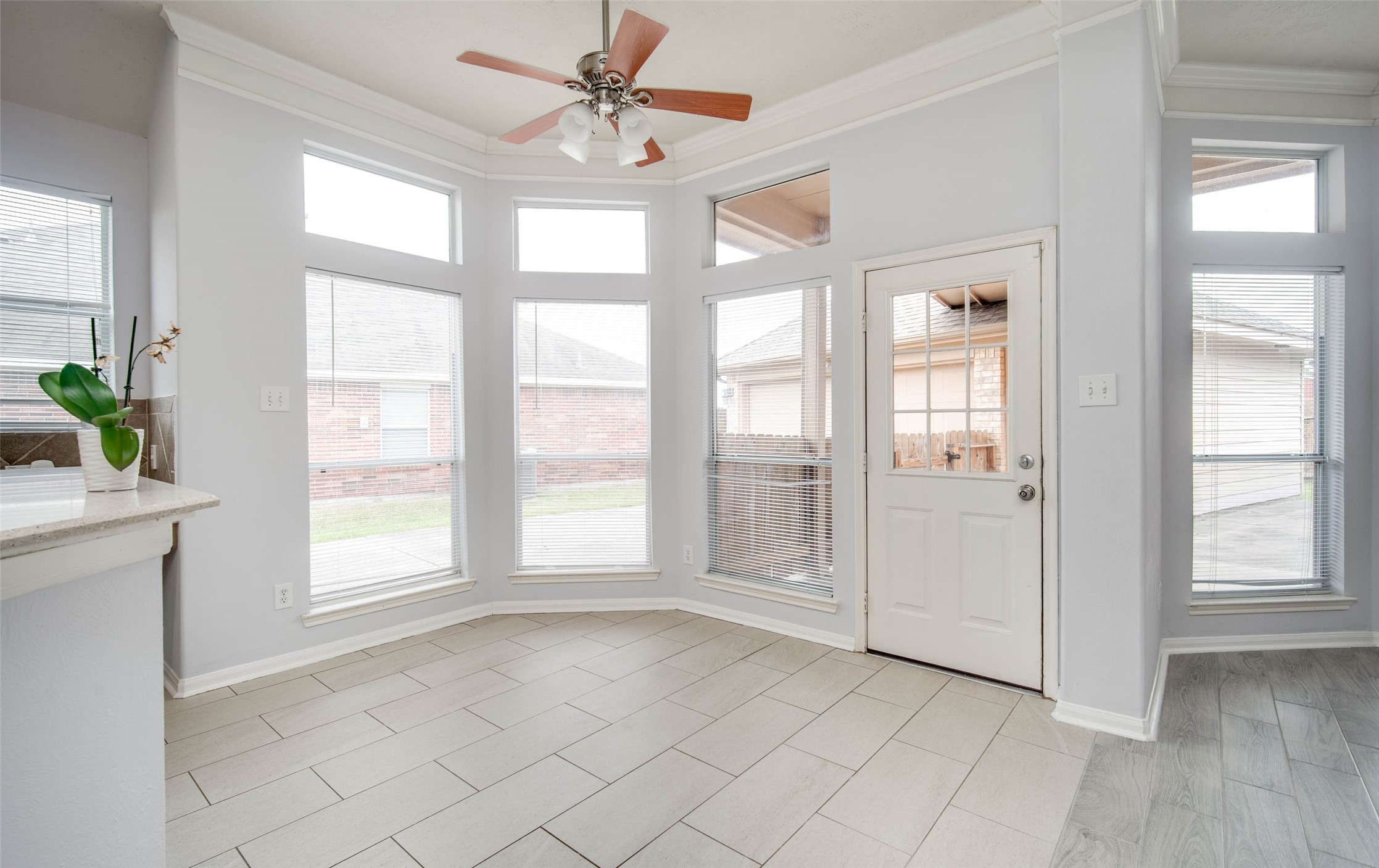 9323 Hillhaven Court Rosenberg, TX 77469 - Photo 19 of 37 an empty room with chandelier fan and windows