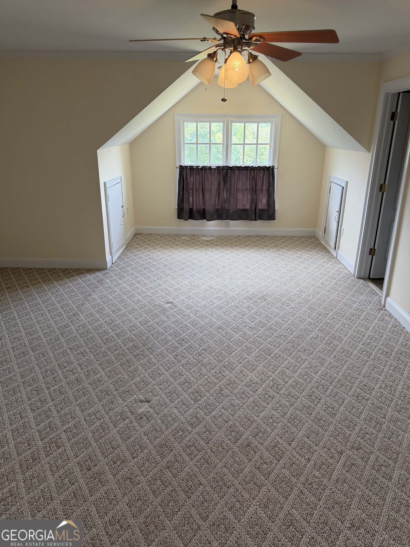 302 Norris Road Barnesville, GA 30204 - Photo 53 of 65 an empty room with a ceiling fan and window