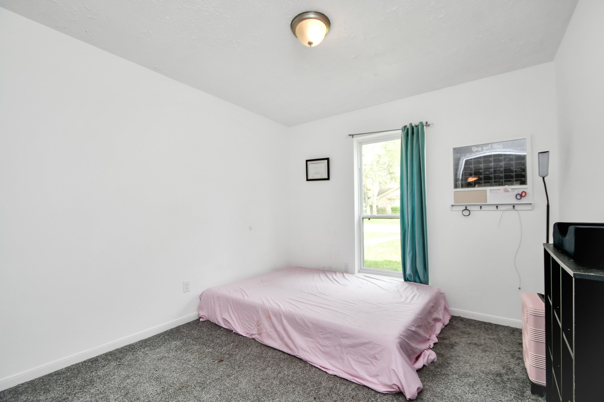 22723 Earlmist Drive Spring, TX 77373 - Photo 14 of 20 a bedroom with a bed and a flat screen tv