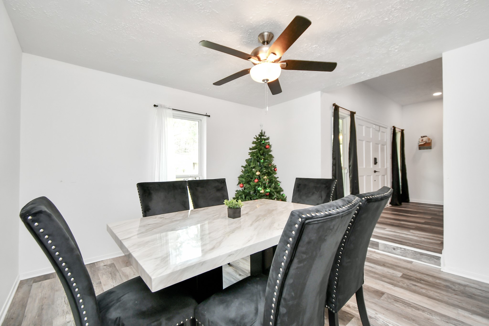 22723 Earlmist Drive Spring, TX 77373 - Photo 8 of 20 a view of a dining room with furniture and wooden floor