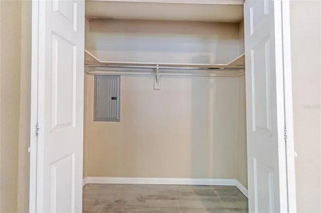 a view of walk in closet with empty racks