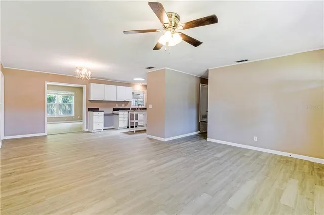 a view of a kitchen with a sink and a window