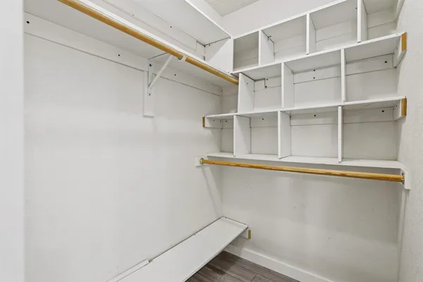 a view of storage and utility room with racks on the wall