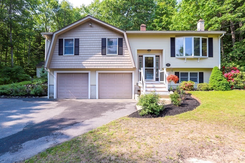 120 Brooks Village Road Templeton, MA 01468 - Photo 1 of 40 a front view of a house with garden
