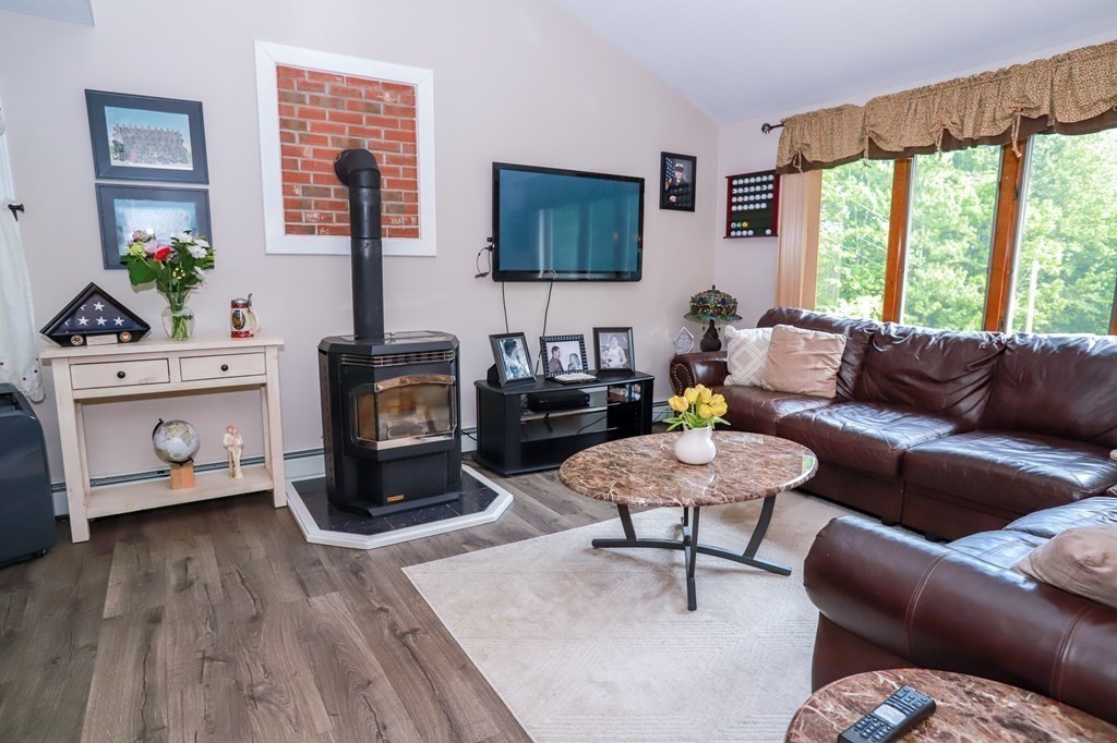 120 Brooks Village Road Templeton, MA 01468 - Photo 14 of 40 a living room with furniture and a flat screen tv