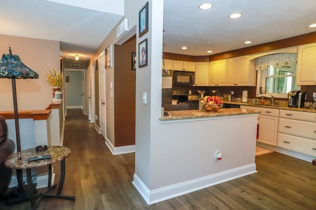 120 Brooks Village Road Templeton, MA 01468 - Photo 17 of 40 a view of a kitchen with furniture and wooden floor