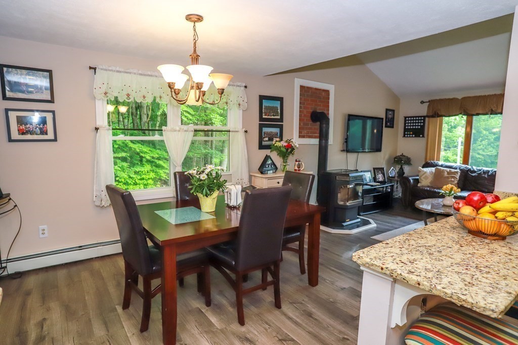 120 Brooks Village Road Templeton, MA 01468 - Photo 26 of 40 a dining room with furniture a large window and wooden floor