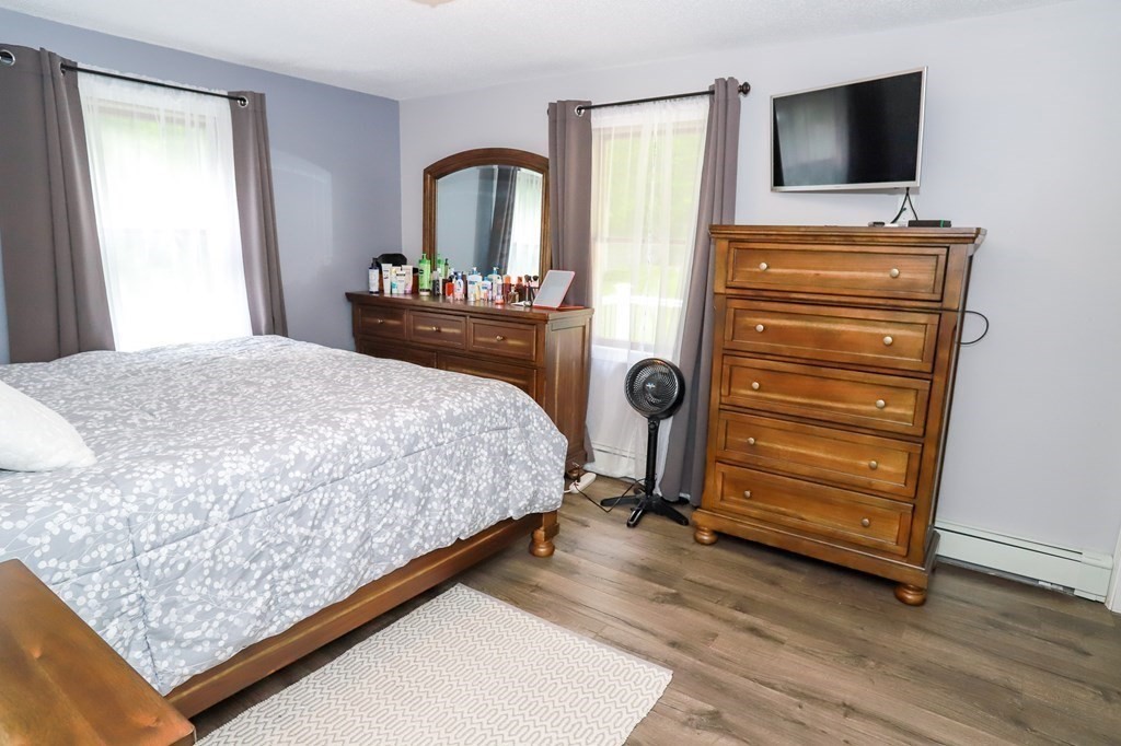 120 Brooks Village Road Templeton, MA 01468 - Photo 29 of 40 a bedroom with a bed and a television