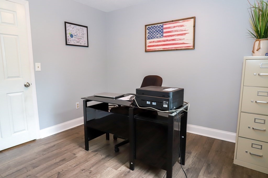 120 Brooks Village Road Templeton, MA 01468 - Photo 36 of 40 a view of a workspace with furniture and wooden floor