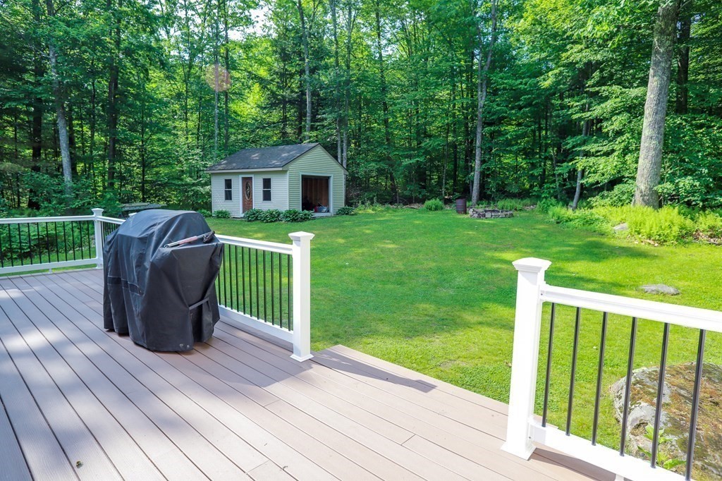 120 Brooks Village Road Templeton, MA 01468 - Photo 10 of 40 a view of a wooden deck and a yard