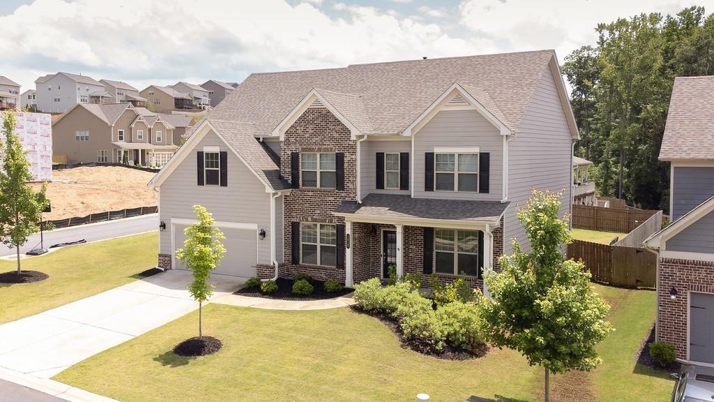 4015 Grandview Manor Drive Cumming, GA 30028 - Photo 1 of 1 a front view of a house with a yard and garage