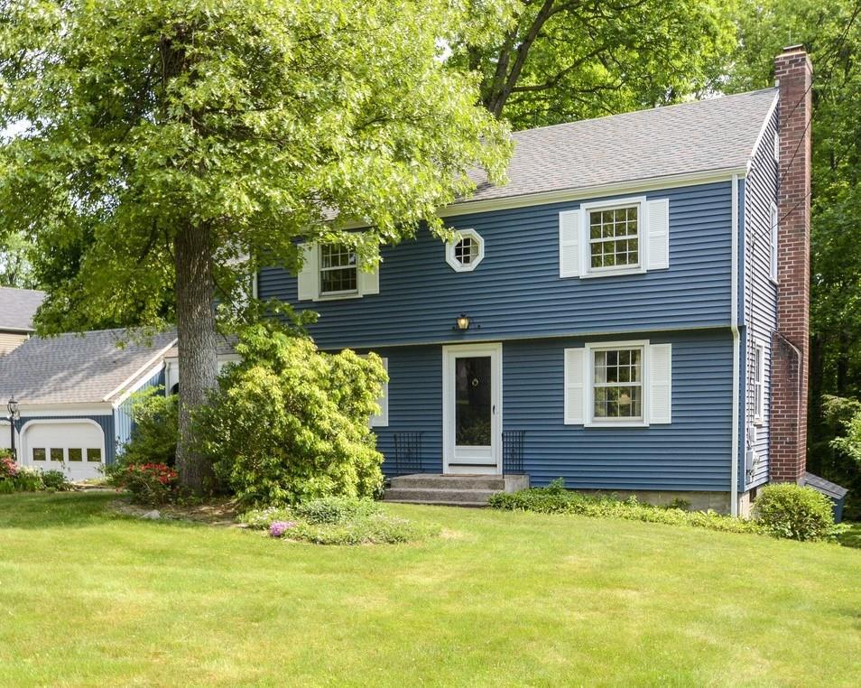 a front view of a house with a yard