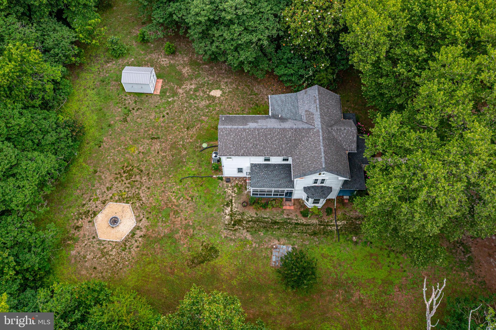 3952 Irvington Road Irvington, VA 22480 - Photo 63 of 77 an aerial view of a house with pool yard outdoor seating and yard
